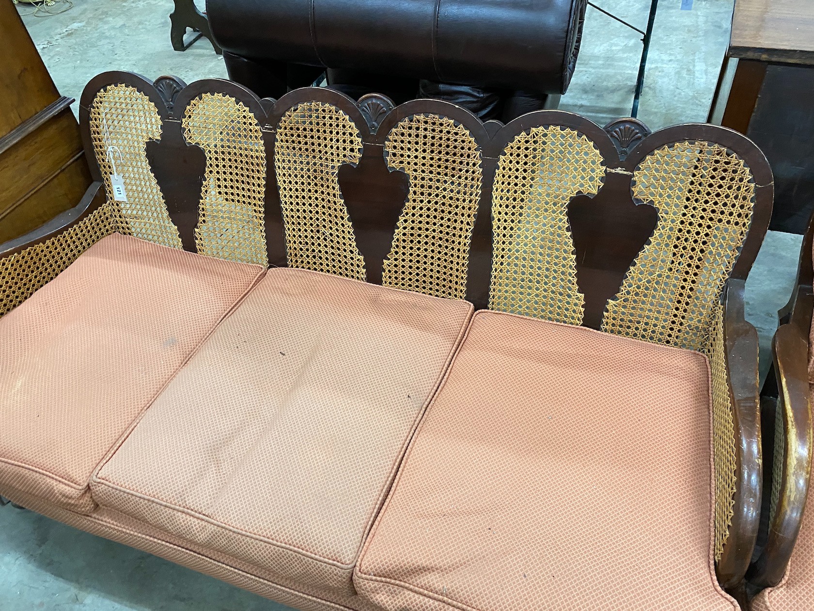 A 1920's caned beech two piece bergere suite, settee length 168cm, depth 72cm, height 82cm